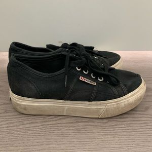 Well-loved black Superga platform sneakers